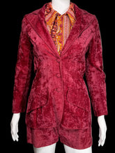 Load image into Gallery viewer, Red textured jacket on a mannequin against a plain wall.