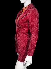 Load image into Gallery viewer, Mannequin wearing a red velvet garment against a plain wall.