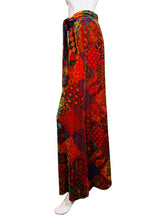 Load image into Gallery viewer, Colorful patterned pants on a mannequin against a white background