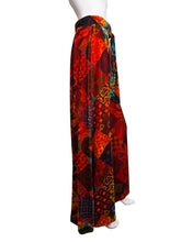 Load image into Gallery viewer, Colorful patterned pants on a mannequin against a white background