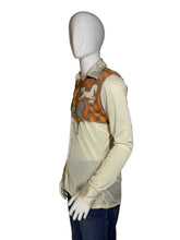 Load image into Gallery viewer, A cream-colored long-sleeve top in side profile view