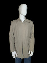 Load image into Gallery viewer, A beige long-sleeve zip-front jacket displayed on a white mannequin torso.