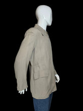 Load image into Gallery viewer, A beige long-sleeve jacket displayed on a white mannequin torso