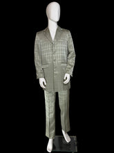 Load image into Gallery viewer, A two-piece men's suit in silvery sage green and gray windowpane plaid pattern, displayed on a white mannequin. The suit includes a single-breasted jacket with notch lapels and a matching pair of trousers.