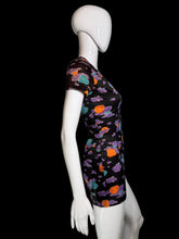 Load image into Gallery viewer, A short-sleeve black romper with a colorful abstract cloud pattern in purple, orange, and teal, displayed on a white mannequin.