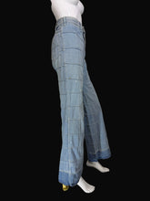 Load image into Gallery viewer, Light blue wide-leg denim jeans with a large grid patchwork pattern, displayed on a white mannequin.