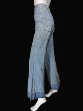 Load image into Gallery viewer, Light blue wide-leg denim jeans with a large windowpane plaid pattern, displayed on a white mannequin.
