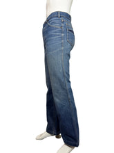 Load image into Gallery viewer, Blue jeans against a white background.