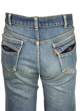 Load image into Gallery viewer, Blue jeans against a white background.