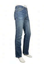 Load image into Gallery viewer, Blue jeans against a white background.