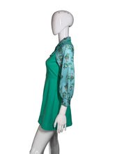Load image into Gallery viewer, A green dress with a light blue patterned long-sleeve shirt-style overlay, displayed on a white mannequin.