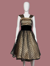 Load image into Gallery viewer, Black and cream polka dot dress on a mannequin with a plain background