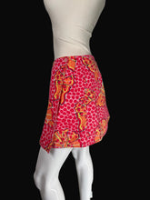 Load image into Gallery viewer, A red and orange skirt displayed on a white mannequin.