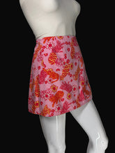 Load image into Gallery viewer, A pink skirt with a colorful pattern of orange tigers and flowers, displayed on a white mannequin.