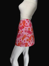 Load image into Gallery viewer, A pink skirt with bold orange and red tiger and floral pattern, shown wrapped around a white mannequin.