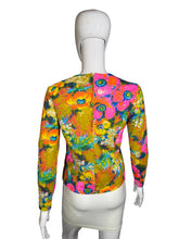 Load image into Gallery viewer, Colorful floral-patterned top on a mannequin against a neutral background