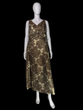 Load image into Gallery viewer, A sleeveless V-neck maxi dress with a brown and gold floral jacquard pattern, displayed on a white mannequin.