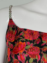 Load image into Gallery viewer, A close-up of a strapless dress or top with a vibrant floral print in pink, red, and orange on a black background, displayed on a white mannequin torso with a rhinestone-embellished strap visible.