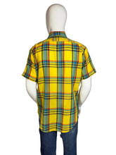 Load image into Gallery viewer, Mannequin wearing a yellow plaid shirt on a plain background