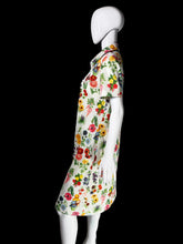 Load image into Gallery viewer, A short-sleeve collared dress with a colorful floral print on a white base, displayed on a white mannequin