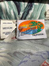 Load image into Gallery viewer, Close-up of a woven brand label reading Kennington California on a white fabric tag, with another sewn-in tag below showing 100% nylon and medium size, set against a patterned textile background.