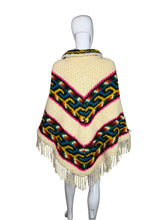 Load image into Gallery viewer, Colorful knitted poncho with patterns on a mannequin against a white background