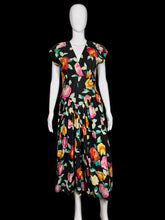 Load image into Gallery viewer, Floral dress on a mannequin against a white wall