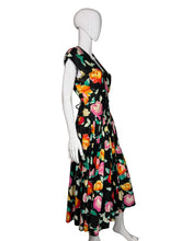 Load image into Gallery viewer, Mannequin wearing a colorful floral dress against a white wall.