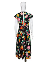 Load image into Gallery viewer, Floral dress on a mannequin against a plain background