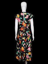 Load image into Gallery viewer, Floral dress on a mannequin against a plain background