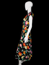 Load image into Gallery viewer, Mannequin wearing a colorful floral dress on a white background