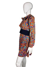 Load image into Gallery viewer, Colorful floral dress on a mannequin against a white background