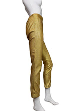 Load image into Gallery viewer, Gold pants on a mannequin against a white wall.