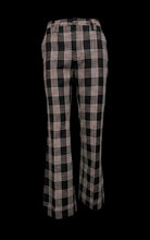 Load image into Gallery viewer, Black and white plaid pants on a mannequin against a plain background