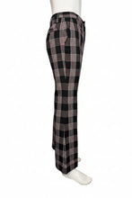 Load image into Gallery viewer, Black and white plaid pants on a mannequin against a plain background