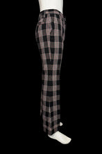 Load image into Gallery viewer, Black and white plaid pants on a mannequin against a plain background