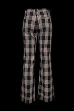 Load image into Gallery viewer, Black and white plaid pants on a mannequin against a plain background