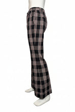 Load image into Gallery viewer, Black and white plaid pants on a mannequin against a plain background