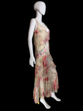 Load image into Gallery viewer, A sleeveless tiered maxi dress with a pink and red floral print on a beige base, displayed on a white mannequin.