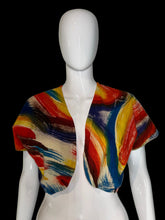 Load image into Gallery viewer, A short-sleeve cropped shrug or bolero jacket with a matching abstract brushstroke pattern in red, yellow, blue, and cream, displayed on a white mannequin torso.