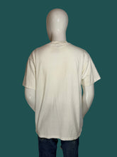 Load image into Gallery viewer, An oversized white cotton t-shirt displayed on a white mannequin from the back.