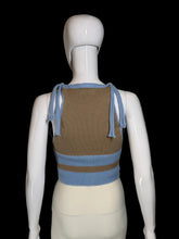 Load image into Gallery viewer, A back view of a sleeveless knit cardigan top displayed on a white mannequin. The top features a color block brown light blue knit with a button closure.
