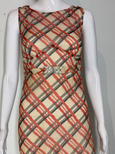 Load image into Gallery viewer, A close up of a 1930's sleeveless V-neck midi dress with a diagonal plaid pattern in red and black on a beige base on a white mannequin.