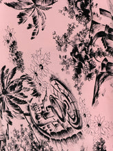 Load image into Gallery viewer, A close-up of a pink fabric featuring a black hand-drawn style botanical and architectural pattern with palm leaves, flowers, and a stylized wheel motif.
