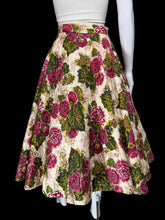 Load image into Gallery viewer, A high-waisted A-line skirt with a vintage floral print, displayed on a white mannequin torso. The skirt features large pink and burgundy roses with green leaves on a cream background.