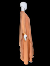 Load image into Gallery viewer, An orange vintage maxi dress with sheer draping sleeves displayed on a white mannequin.