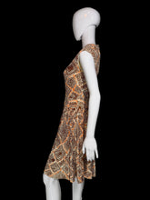 Load image into Gallery viewer, A sleeveless fit-and-flare dress with a geometric diamond pattern in orange, brown, and beige, displayed on a white mannequin.