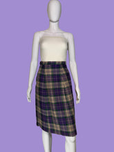 Load image into Gallery viewer, A purple, green, and cream plaid skirt displayed on a white mannequin.