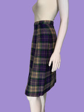 Load image into Gallery viewer, A purple, green, and cream plaid skirt displayed on a white mannequin.