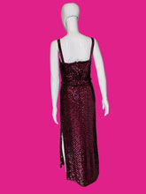 Load image into Gallery viewer, A sleeveless, floor-length burgundy sequined gown displayed on a white mannequin.